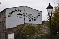 VIA REGIA SCULPTURA: Wandbild der ukrainischen Künstlergruppe R.E.P.Group (Revolutionary Experimental Space) aus der Serie »Patriotismus« an einer Fassade am Neißufer in Görlitz